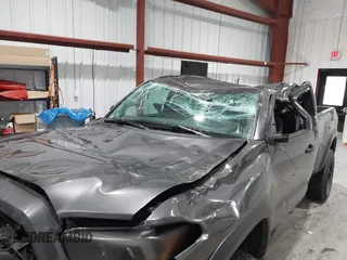 2021 Toyota Tacoma SR with VIN 3TYRX5GN8MT011370, listed as a IAAI auction lot 41287330 with 73,447 mi miles and . Bid and sale history available at DreamBid. Image 6.