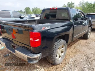 2014 Chevrolet Silverado 1500 LTZ with VIN 3GCUKSEC7EG557551, listed as a IAAI auction lot 41936077 with 227,097 mi miles and . Bid and sale history available at DreamBid. Image 4.