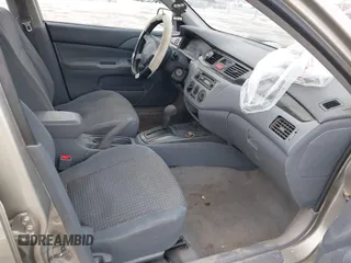 2002 Mitsubishi Lancer ES with VIN JA3AJ26E62U043039, listed as a IAAI auction lot 41600217 with 141,217 mi miles. Bid and sale history available at carsss.com. Image 5.