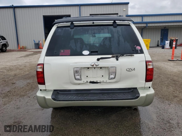 2003 Infiniti QX4 with VIN JNRDR09X83W251941, listed as a Copart auction lot 71044774 with 162,214 mi miles and Salvage Title. Bid and sale history available at DreamBid. Image 6.