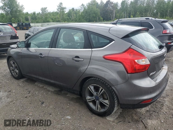 2014 Ford Focus Titanium with VIN 1FADP3N20EL329415, listed as a Copart auction lot 60881115 with 97,382 mi miles and Salvage title. Bid and sale history available at DreamBid. Image 2.