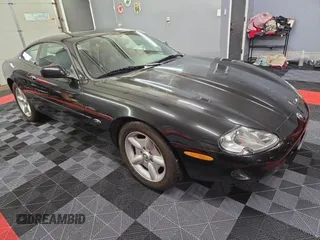 1997 Jaguar XK with VIN SAJGX5748VC006720, listed as a Copart auction lot 80928284 with 96,279 mi miles and Clean Title. Bid and sale history available at DreamBid. Image 1.