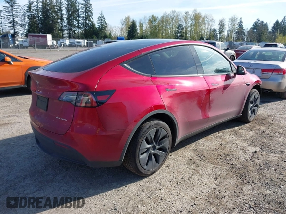 2024 Tesla Model Y Long Range with VIN 7SAYGDEE9RF199805, listed as a IAAI auction lot 42018221 with 7,359 mi miles. Bid and sale history available at carsss.com. Image 4.