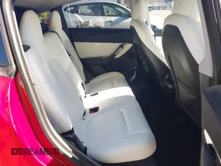 2020 Tesla Model Y Long Range with VIN 5YJYGDEE8LF057014, listed as a IAAI auction lot 41988113 with 18,246 mi miles and . Bid and sale history available at DreamBid. Image 8.