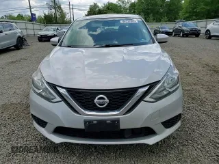 2018 Nissan Sentra S z VIN 3N1AB7AP6JY340671, wystawiony jako Copart lot #56253365 z przebiegiem 101 968 mil mil oraz Szkoda całkowita • Salvage title. Historia ofert i sprzedaży dostępna na DreamBid. Obrazek 13.