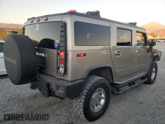 2003 Hummer H2 with VIN 5GRGN23U33H124696, listed as a Copart auction lot 79452004 with 154,144 mi miles and Salvage Title. Bid and sale history available at carsss.com. Image 3.