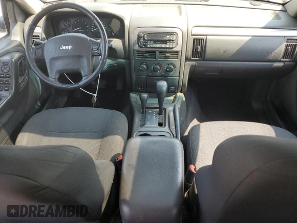 2002 Jeep Grand Cherokee Laredo with VIN 1J4GW48S92C319161, listed as a Copart auction lot 59304035 with 257,907 mi miles and Salvage title. Bid and sale history available at DreamBid. Image 8.