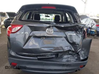 2014 Mazda CX-5 Touring with VIN JM3KE2CY9E0384401, listed as a IAAI auction lot 41699913 with 75,301 mi miles. Bid and sale history available at carsss.com. Image 16.