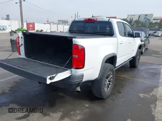 2018 Chevrolet Colorado 4WD ZR2 with VIN 1GCPTEE19J1175475, listed as a IAAI auction lot 41473714 with 107,809 mi miles. Bid and sale history available at carsss.com. Image 4.
