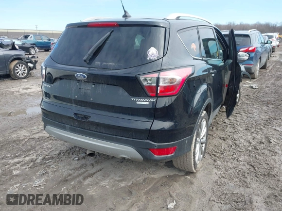 2018 Ford Escape Titanium with VIN 1FMCU0J90JUD17085, listed as a IAAI auction lot 41699687 with Not provided miles and . Bid and sale history available at DreamBid. Image 4.