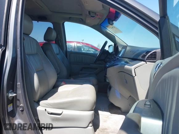 2007 Honda Odyssey EX-L z VIN 5FNRL38797B137595, wystawiony jako IAAI lot #42002233 z przebiegiem 192 296 mil mil oraz . Historia ofert i sprzedaży dostępna na DreamBid. Obrazek 5.