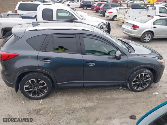 2016 Mazda CX-5 Grand Touring with VIN JM3KE4DY8G0796290, listed as a IAAI auction lot 41619977 with NaN miles. Bid and sale history available at carsss.com. Image 13.