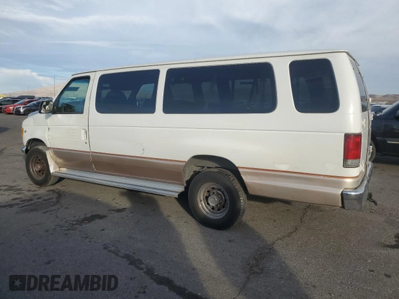 2000 Ford Econoline Passenger XL with VIN 1FBSS31L5YHA09064, listed as a Copart auction lot 84828844 with 257,973 mi miles and Salvage Title. Bid and sale history available at DreamBid. Image 2.