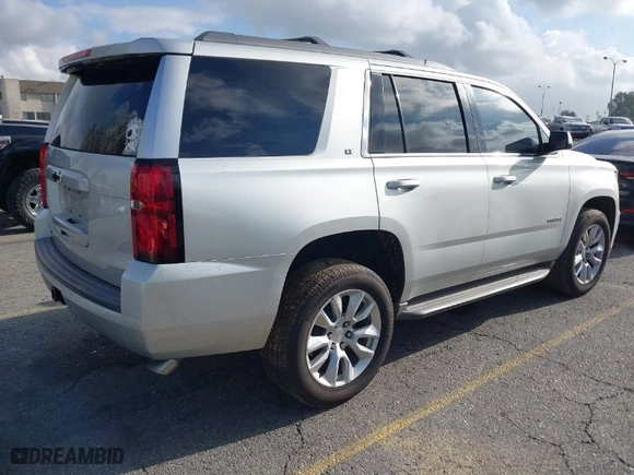 2015 Chevrolet Tahoe LT with VIN 1GNSCBKC8FR114732, listed as a IAAI auction lot 41900157 with 107,298 mi miles. Bid and sale history available at carsss.com. Image 4.