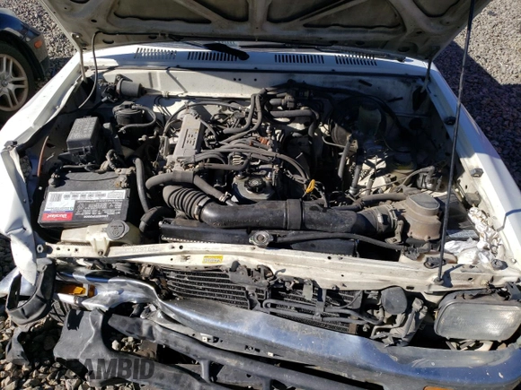 1994 Toyota Pickup DX z VIN JT4RN81P0R5200010, wystawiony jako Copart lot #89184805 z przebiegiem 123 270 mil mil oraz Szkoda całkowita • Salvage title. Historia ofert i sprzedaży dostępna na DreamBid. Obrazek 11.