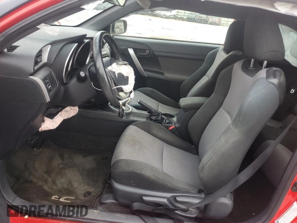 2014 Scion tC z VIN JTKJF5C79E3079305, wystawiony jako Copart lot #51750825 z przebiegiem 175 801 mil mil oraz Szkoda całkowita • Salvage title. Historia ofert i sprzedaży dostępna na DreamBid. Obrazek 7.
