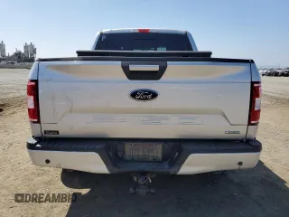 2018 Ford F-150 XL with VIN 1FTEW1CGXJFB40297, listed as a Copart auction lot 69642404 with 92,561 mi miles and Salvage title. Bid and sale history available at DreamBid. Image 6.