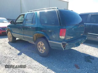1997 GMC Jimmy SLE z VIN 1GKCS13W0V2524634, wystawiony jako IAAI lot #42196586 z przebiegiem 371 254 mil mil oraz . Historia ofert i sprzedaży dostępna na DreamBid. Obrazek 3.