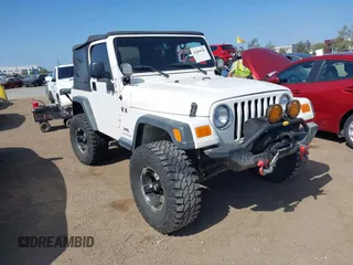 2006 Jeep Wrangler X z VIN 1J4FA39S06P726271, wystawiony jako IAAI lot #42085938 z przebiegiem 77 933 mil mil oraz . Historia ofert i sprzedaży dostępna na DreamBid. Obrazek 1.