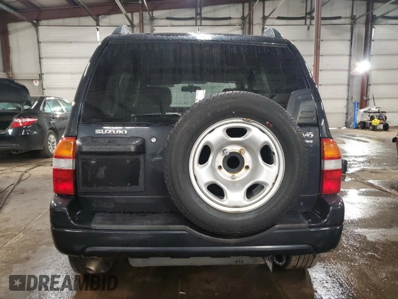 2003 Suzuki Grand Vitara z VIN JS3TD62V234100175, wystawiony jako Copart lot #47174605 z przebiegiem 88 451 mil mil oraz Szkody całkowita. Historia ofert i sprzedaży dostępna na DreamBid. Obrazek 6.