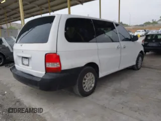 2003 Kia Sedona LX with VIN KNDUP131536402900, listed as a IAAI auction lot 41500260 with 143,825 mi miles and . Bid and sale history available at DreamBid. Image 4.
