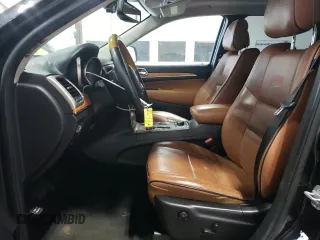 2013 Jeep Grand Cherokee Overland with VIN 1C4RJFCG7DC646348, listed as a Copart auction lot 49526415 with 137,889 mi miles and Clean Title. Bid and sale history available at carsss.com. Image 7.