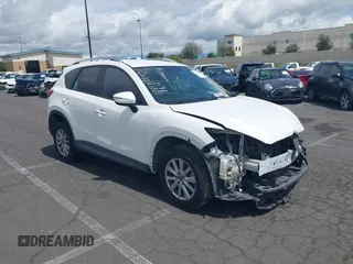 2016 Mazda CX-5 Sport with VIN JM3KE2BY9G0792319, listed as a IAAI auction lot 41685745 with 134,717 mi miles. Bid and sale history available at carsss.com. Image 1.