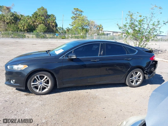 2015 Ford Fusion Titanium Hybrid with VIN 3FA6P0RUXFR119698, listed as a IAAI auction lot 41791411 with 140,646 mi miles. Bid and sale history available at carsss.com. Image 15.