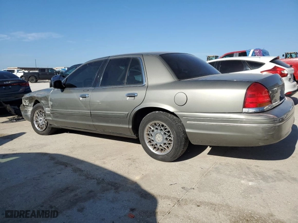 2002 Ford Crown Victoria Standard with VIN 2FAFP73WX2X103936, listed as a Copart auction lot 67688374 with 161,511 mi miles and Salvage Title. Bid and sale history available at carsss.com. Image 2.