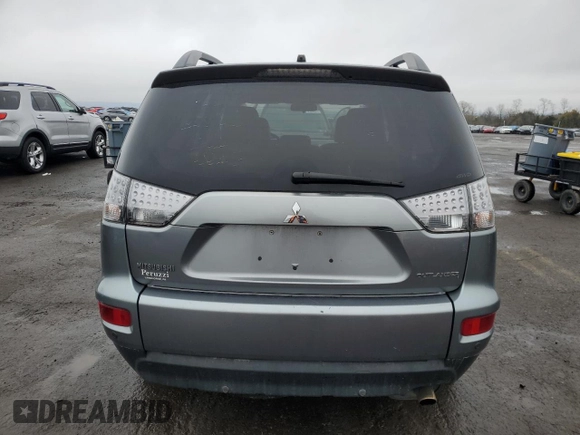 2013 Mitsubishi Outlander SE z VIN JA4JT3AW4DU000656, wystawiony jako Copart lot #51808395 z przebiegiem 158 479 mil mil oraz Szkoda całkowita • Salvage title. Historia ofert i sprzedaży dostępna na DreamBid. Obrazek 6.