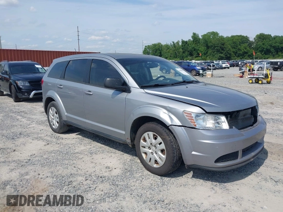 2015 Dodge Journey SE z VIN 3C4PDCAB0FT698674, wystawiony jako IAAI lot #42308994 z przebiegiem 97 640 mil mil oraz . Historia ofert i sprzedaży dostępna na DreamBid. Obrazek 1.