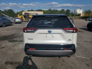2021 Toyota RAV4 Hybrid XSE with VIN 2T3E6RFV1MW028094, listed as a Copart auction lot 52596615 with 68,497 mi miles and Salvage title. Bid and sale history available at DreamBid. Image 6.