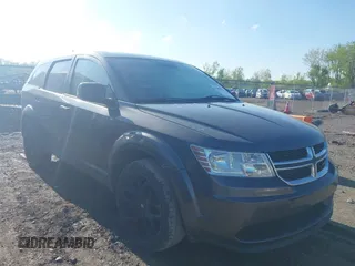 2015 Dodge Journey SE z VIN 3C4PDCAB4FT675074, wystawiony jako IAAI lot #42059878 z przebiegiem 99 947 mil mil oraz . Historia ofert i sprzedaży dostępna na DreamBid. Obrazek 1.
