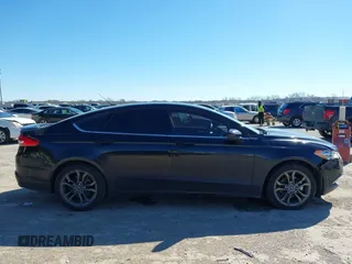 2018 Ford Fusion SE z VIN 3FA6P0H77JR180057, wystawiony jako IAAI lot #41729451 z przebiegiem 122 200 mil mil oraz . Historia ofert i sprzedaży dostępna na DreamBid. Obrazek 13.
