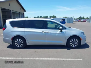 2023 Chrysler Pacifica Hybrid Touring L with VIN 2C4RC1L75PR614460, listed as a IAAI auction lot 42628545 with 68,668 mi miles and . Bid and sale history available at DreamBid. Image 13.