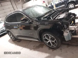 2016 BMW X1 xDrive28i with VIN WBXHT3C33GP886935, listed as a IAAI auction lot 41707367 with 73,201 mi miles. Bid and sale history available at carsss.com. Image 14.