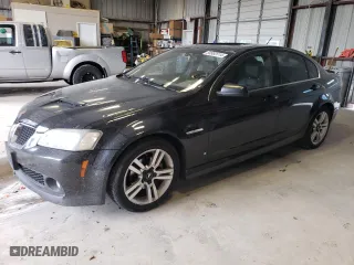 2009 Pontiac G8 with VIN 6G2ER57749L228811, listed as a Copart auction lot 59982614 with 184,222 mi miles and Salvage Title. Bid and sale history available at carsss.com. Image 1.