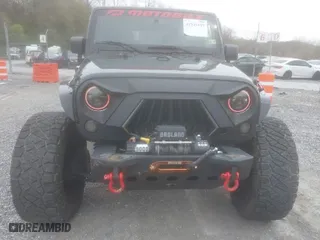 2013 Jeep Wrangler Unlimited Sport with VIN 1C4BJWDG5DL504368, listed as a IAAI auction lot 41941659 with 117,838 mi miles. Bid and sale history available at carsss.com. Image 12.