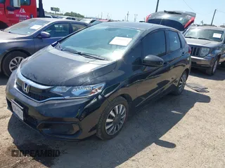 2019 Honda Fit LX z VIN 3HGGK5H45KM753568, wystawiony jako IAAI lot #42004174 z przebiegiem 96 406 mil mil oraz . Historia ofert i sprzedaży dostępna na DreamBid. Obrazek 2.