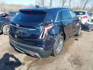 2021 Cadillac XT5 FWD Premium Luxury z VIN 1GYKNCRS2MZ141440, wystawiony jako IAAI lot #41874409 z przebiegiem 76 911 mil mil oraz . Historia ofert i sprzedaży dostępna na DreamBid. Obrazek 4.