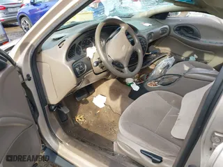 1999 Ford Taurus SE with VIN 1FAFP53U3XA131984, listed as a IAAI auction lot 41638566 with 84,836 mi miles. Bid and sale history available at carsss.com. Image 5.