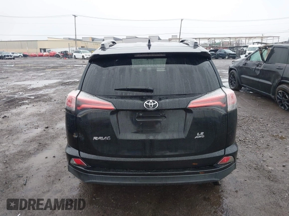 2018 Toyota RAV4 LE with VIN 2T3BFREV2JW788700, listed as a IAAI auction lot 41986212 with 87,704 mi miles. Bid and sale history available at carsss.com. Image 15.