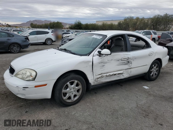 2001 Mercury Sable with VIN 1MEFM53U31A629921, listed as a Copart auction lot 77173754 with 122,769 mi miles and Salvage title. Bid and sale history available at DreamBid. Image 1.
