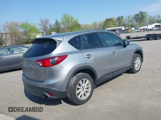 2014 Mazda CX-5 Touring with VIN JM3KE2CY9E0310315, listed as a IAAI auction lot 41943991 with 98,359 mi miles and . Bid and sale history available at carsss.com. Image 4.
