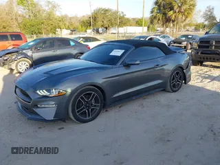 2021 Ford Mustang EcoBoost with VIN 1FATP8UH5M5107597, listed as a IAAI auction lot 41690617 with 54,164 mi miles. Bid and sale history available at carsss.com. Image 2.