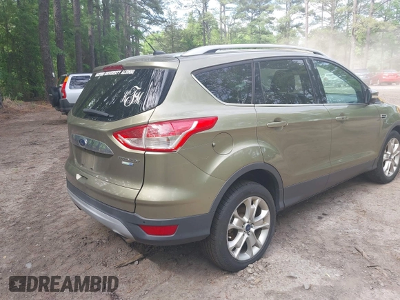 2014 Ford Escape Titanium with VIN 1FMCU9JX9EUB23972, listed as a IAAI auction lot 42217298 with 164,556 mi miles and . Bid and sale history available at DreamBid. Image 4.
