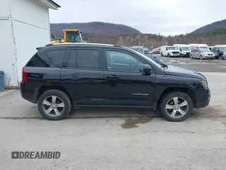 2016 Jeep Compass Latitude with VIN 1C4NJDEB8GD695268, listed as a IAAI auction lot 41724921 with 137,118 mi miles. Bid and sale history available at carsss.com. Image 13.