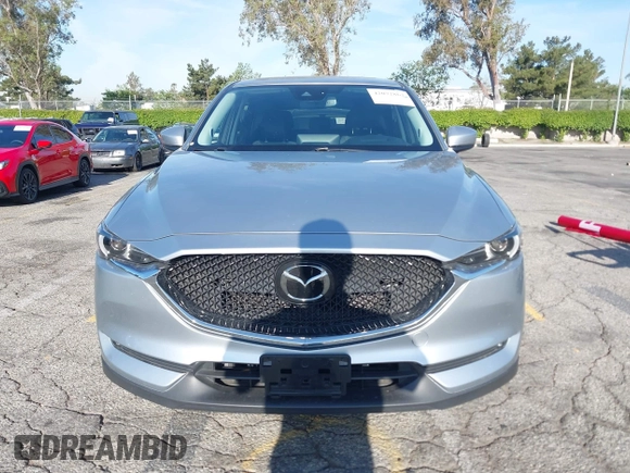 2021 Mazda CX-5 Grand Touring with VIN JM3KFADM1M1393251, listed as a IAAI auction lot 42072862 with 47,758 mi miles. Bid and sale history available at carsss.com. Image 12.