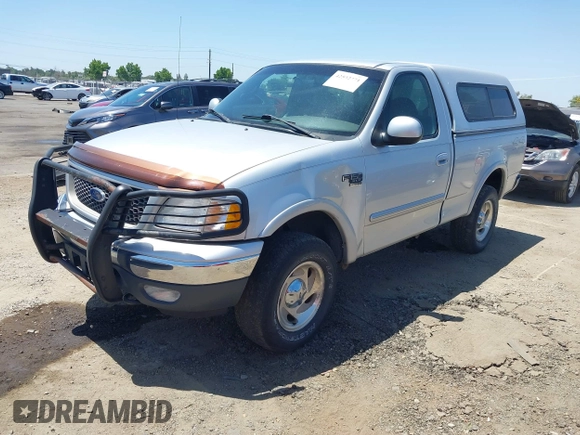 2000 Ford F-150 XL z VIN 1FTRF18L1YKA63179, wystawiony jako IAAI lot #42532771 z przebiegiem 116 604 mil mil oraz . Historia ofert i sprzedaży dostępna na DreamBid. Obrazek 2.