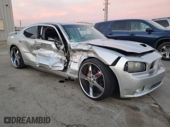 2006 Dodge Charger SRT-8 with VIN 2B3KA73W26H279925, listed as a Copart auction lot 78479574 with 127,443 mi miles and Salvage Title. Bid and sale history available at DreamBid. Image 4.